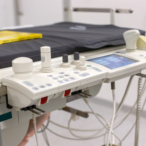 Close-up of an ultrasound machine with probes in a clinical examination room Advanced Medical Equipment for Surgical and Critical Care