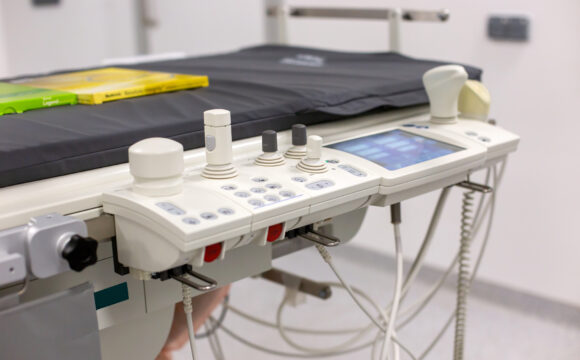 Close-up of an ultrasound machine with probes in a clinical examination room Advanced Medical Equipment for Surgical and Critical Care