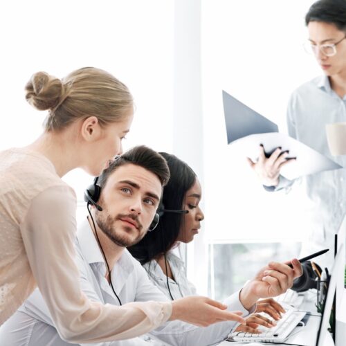 Team of call center operators at work in open space office Reliable Technical Support & Medical Equipment Maintenance